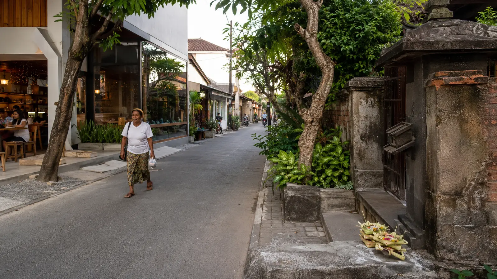 A modern Seminyak street where a café, Balinese family compound and daily offerings share the same neighbourhood